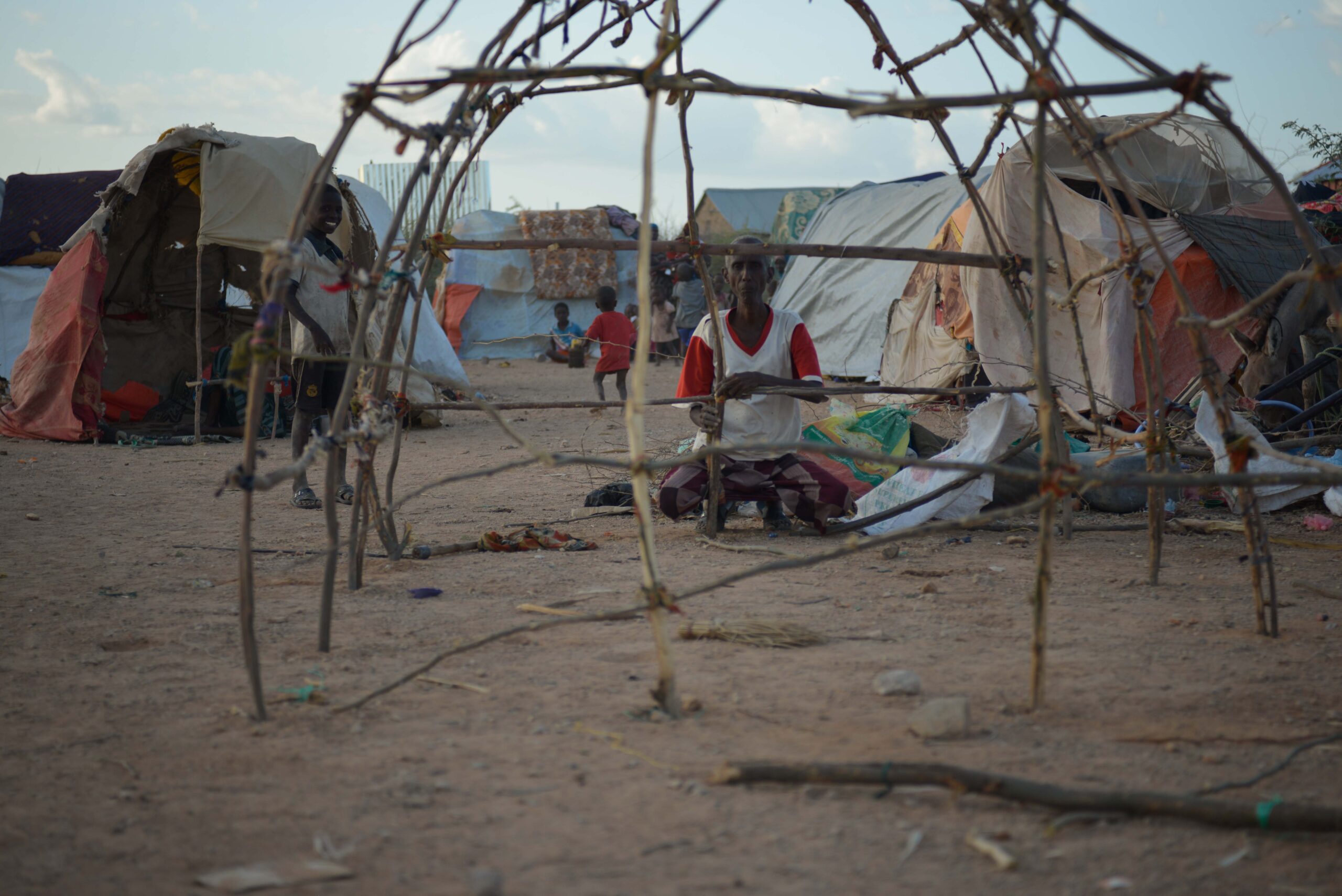 A man builds a temporary shelter at a displacement camp near Beledweyne in 2016.